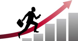 grafica-hombre-negocios-ascendiendo-barras-1200